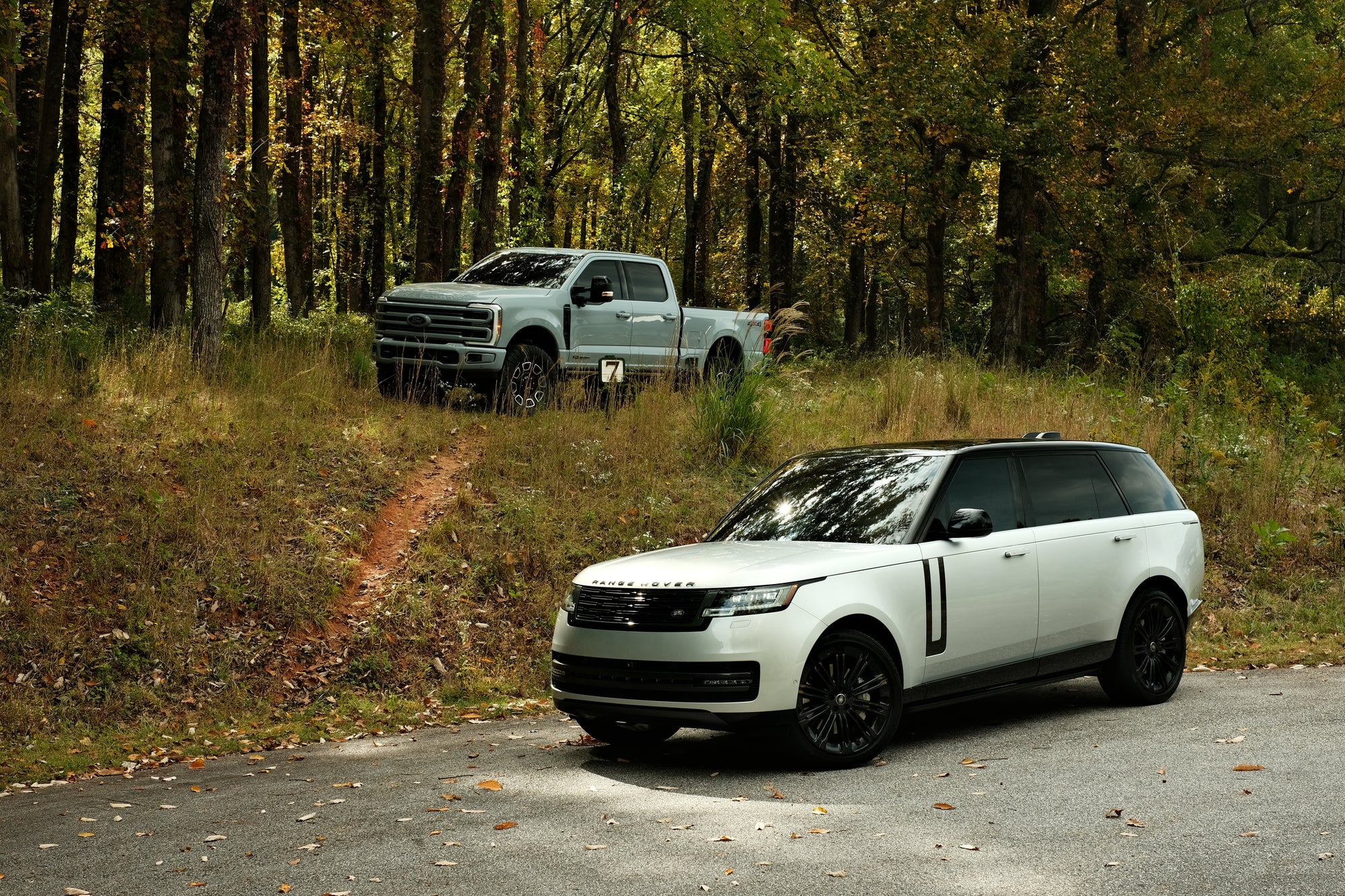 Kingsman Collection vehicles together in the Asheville mountain landscape